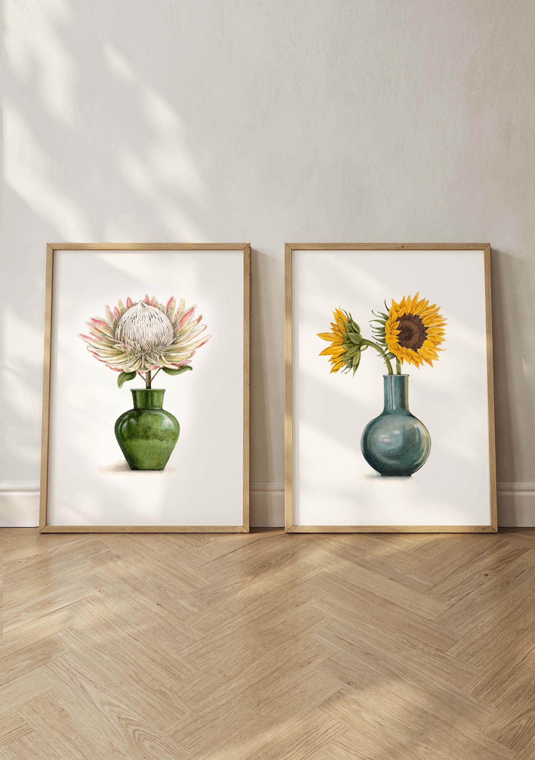 Watercolour illustration by Annie Moag - archival prints of Heritage Treasure and Sun Burst framed standing against a wall on wooden floor